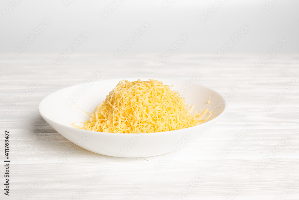 fresh grated cheese. Grater and cheese on board fresh grated cheese. Grater and cheese on board