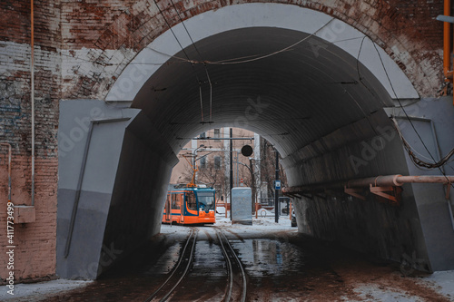 Photography Modern moscow tram running through the arch