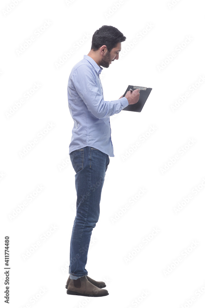 side view. young man pointing at blank in clipboard. side view. young man pointing at blank in clipboard.