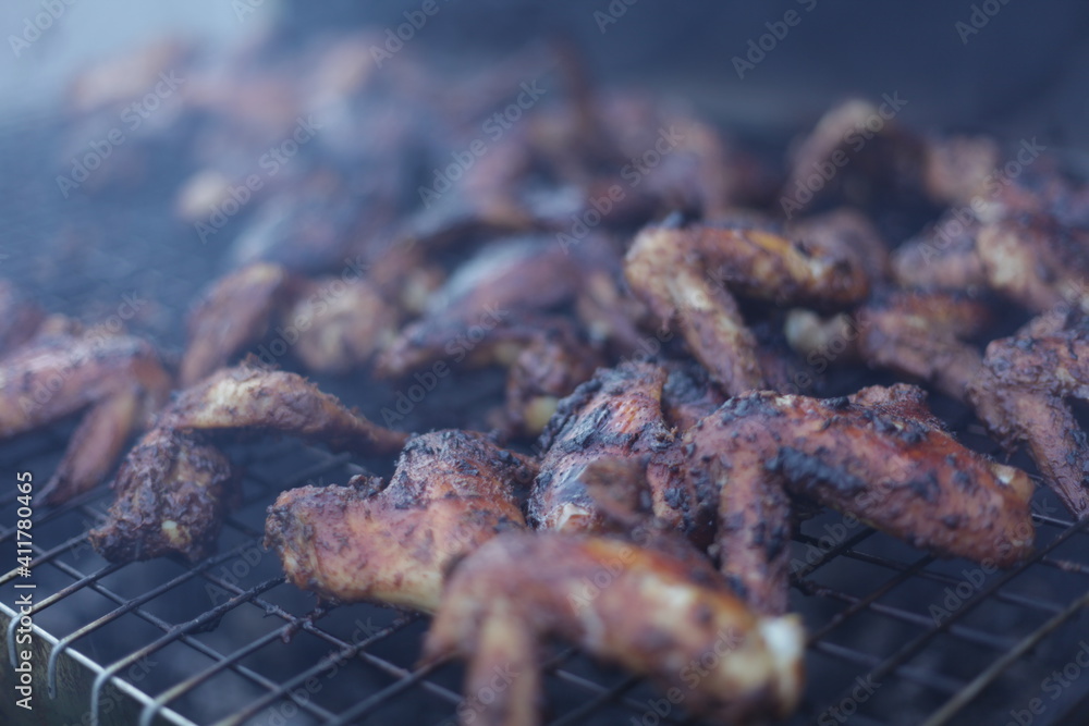 Jamaican Jerk chicken wings in smoker grill Stock Photo Adobe Stock