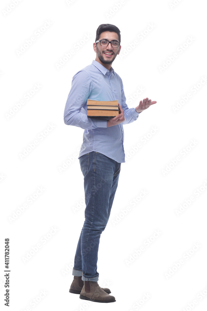 casual young man with a stack of books. casual young man with a stack of books.