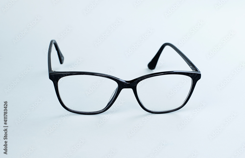 Black Eyeglasses On Light Background. Image With Copy Space