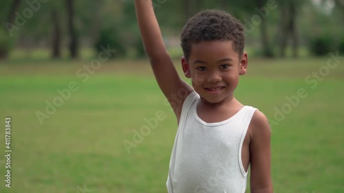 portrait of a child, happy african american kids boy playing outdoors in a park, Kid playing concepts