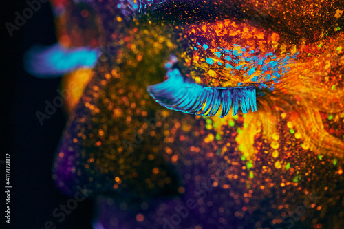 close up uv portrait glowing in a dark