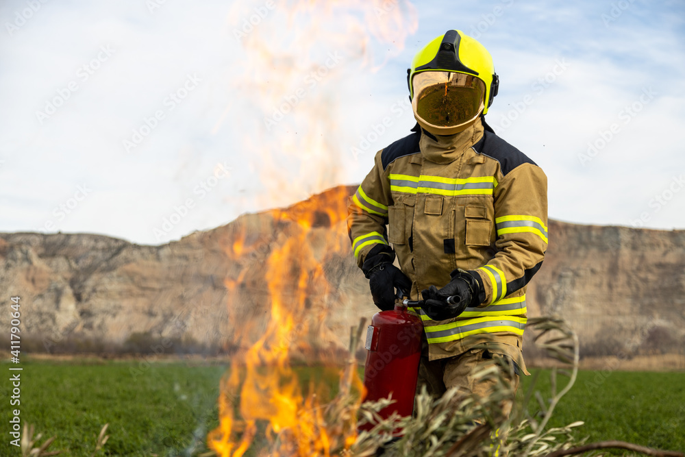 firefighter man in front of fire firefighter man in front of fire