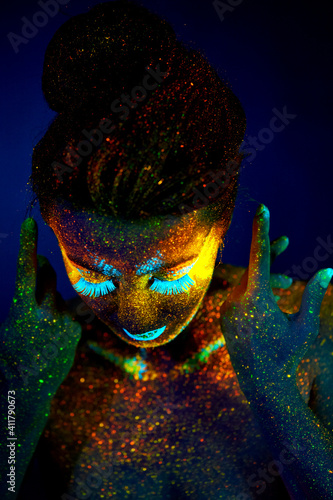 close up uv portrait glowing in a dark