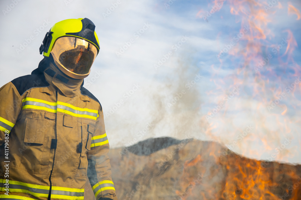 firefighter man in front of fire