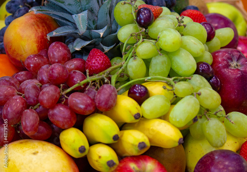 background: Mix of Assorted Fresh fruits at a shop for sale