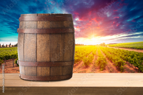 Red wine with barrel on vineyard in green Tuscany, Italy © kishivan