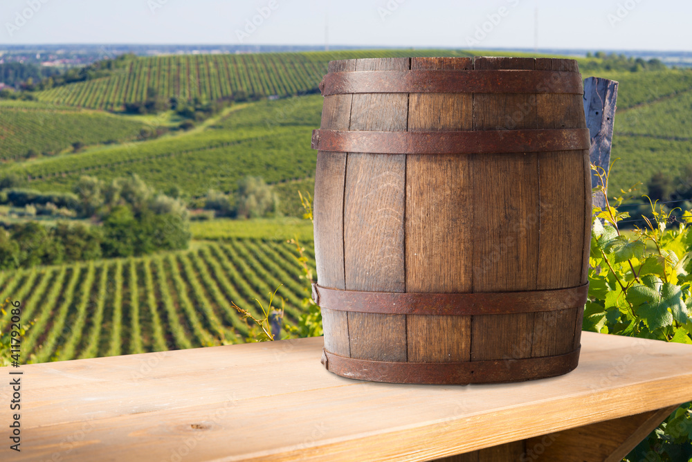 Red wine with barrel on vineyard in green Tuscany, Italy Red wine with barrel on vineyard in green Tuscany, Italy
