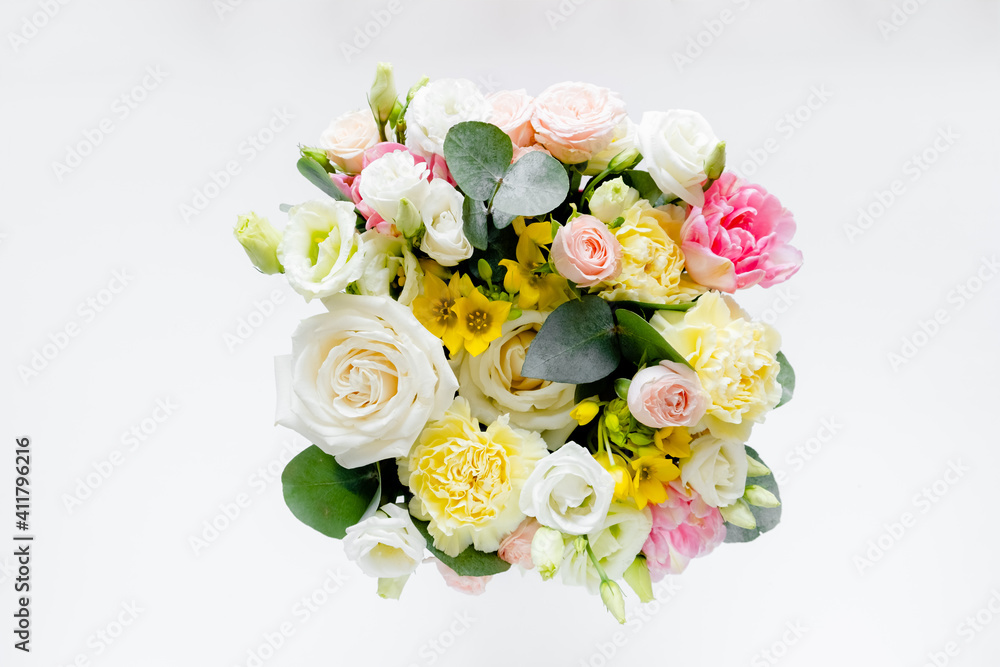 Female hands florist making a bouquet. Step by step instraction. Top horizontal view copyspace abstract pink background