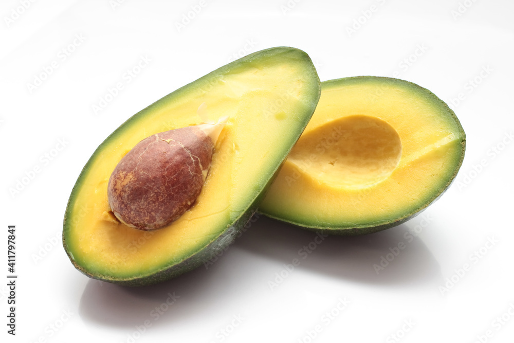 avocado with bone cut on a white background avocado with bone cut on a white background