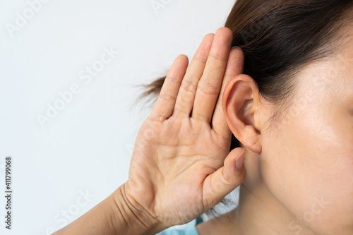 Young Asian woman with hearing problem. Deafness concept.
