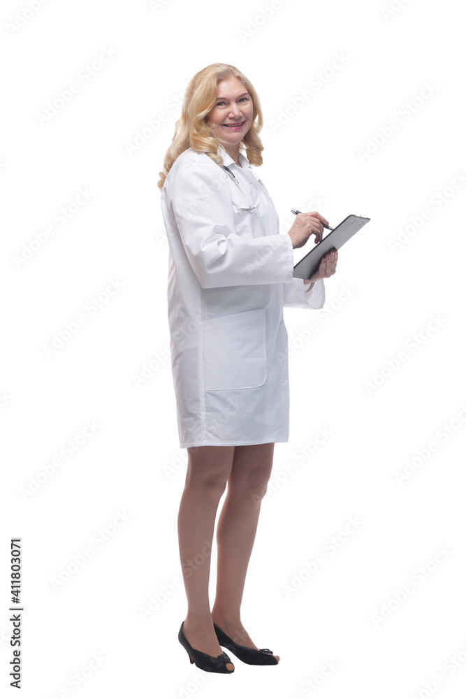 friendly woman doctor making a note in the clipboard . friendly woman doctor making a note in the clipboard .