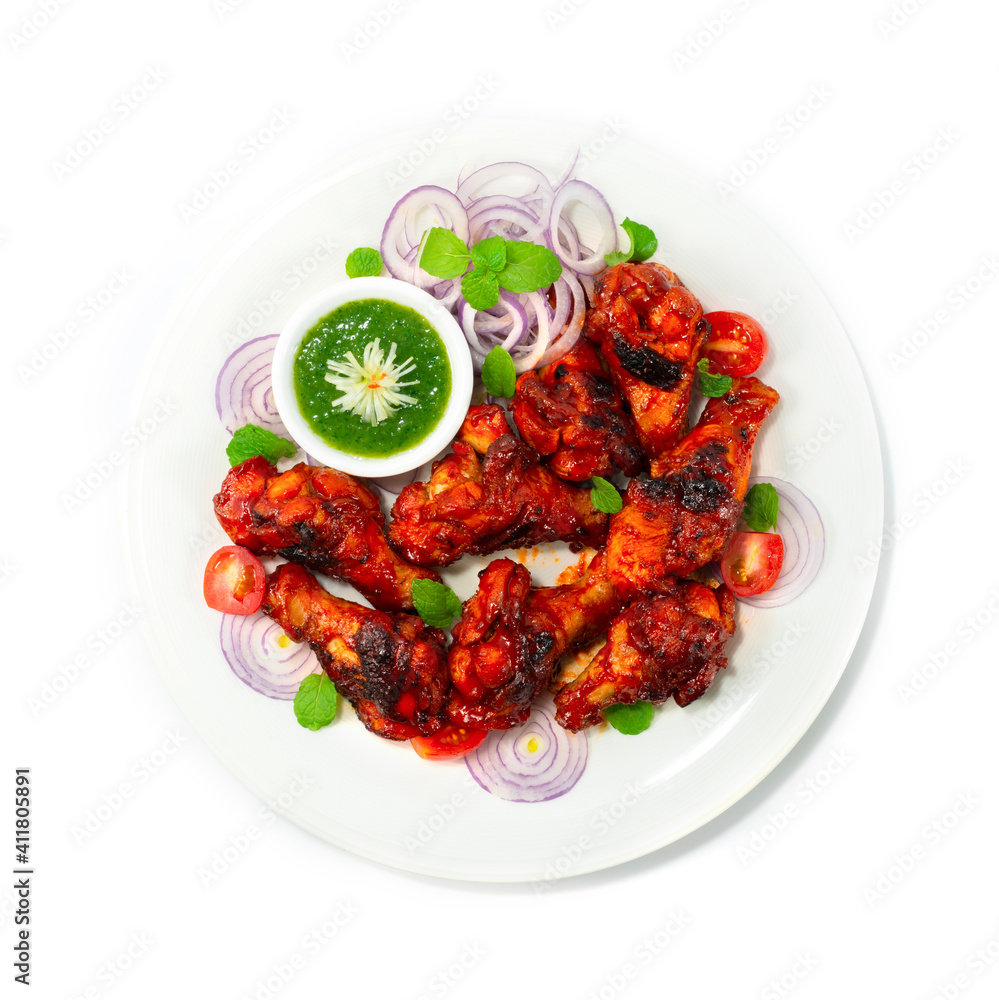 Tandoori Chicken Grilled served Mint Sauce is a classic Indian dinner Tandoori Chicken Grilled served Mint Sauce is a classic Indian dinner