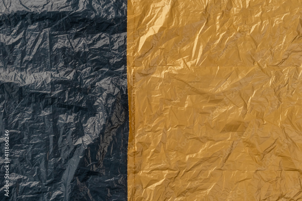 Crumpled wrinkled black beige plastic bag fragment Crumpled wrinkled black beige plastic bag fragment