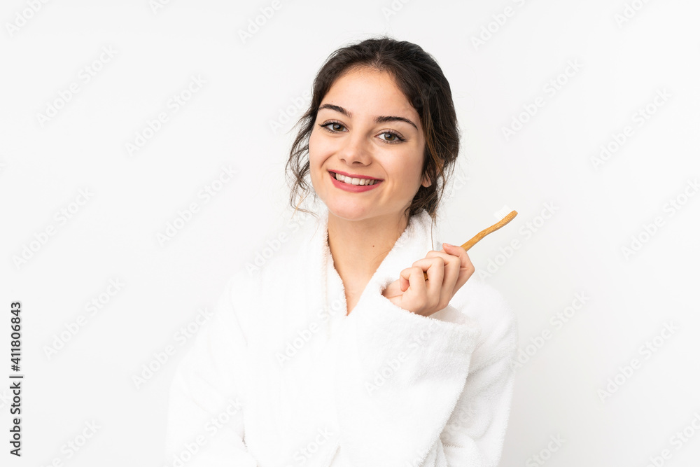 Young caucasian woman isolated on white background with a toothbrush and surprised expression Young caucasian woman isolated on white background with a toothbrush and surprised expression