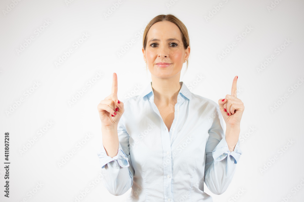 Portrait of young business woman pointing up over white background Portrait of young business woman pointing up over white background