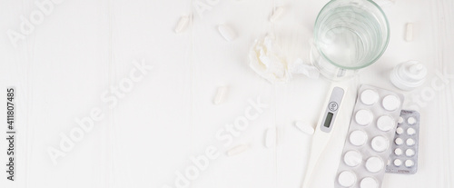 Banner Pills in plastic package. Concept of healthcare and medicine. Coronavirus 2019-nCoV, thermometer, runny nose, treatment of the disease