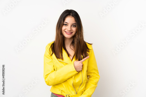 Young caucasian woman isolated on white background pointing to the side to present a product