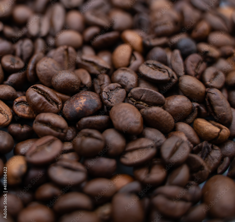 Background image with roasted brown coffee beans Background image with roasted brown coffee beans