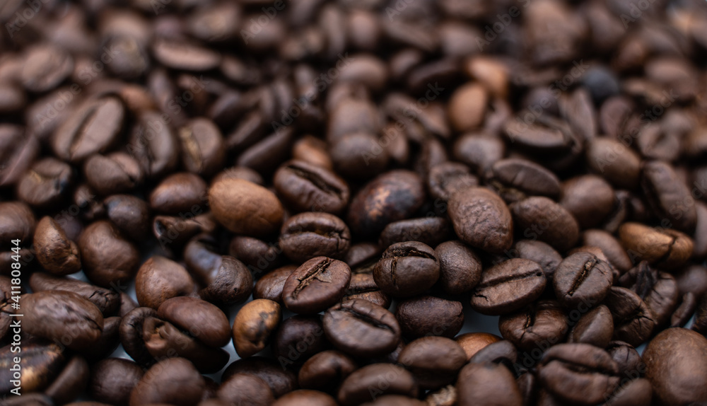 Background image with roasted brown coffee beans Background image with roasted brown coffee beans