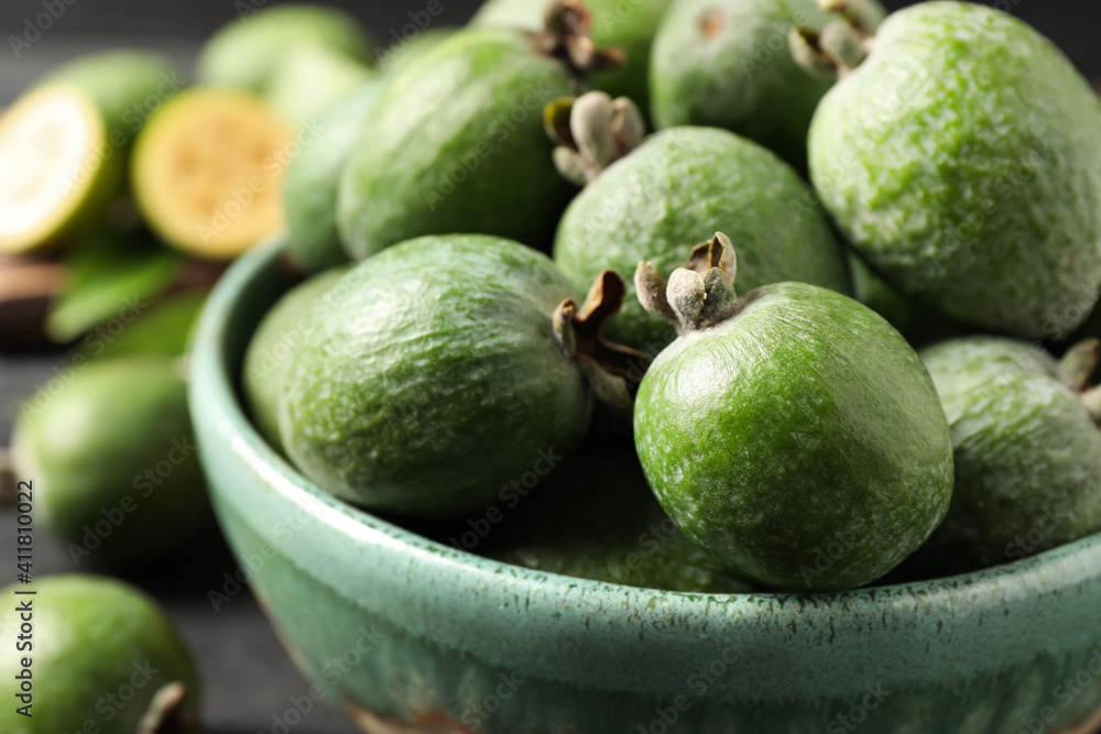 Fresh green feijoa fruits in bowl, closeup Fresh green feijoa fruits in bowl, closeup