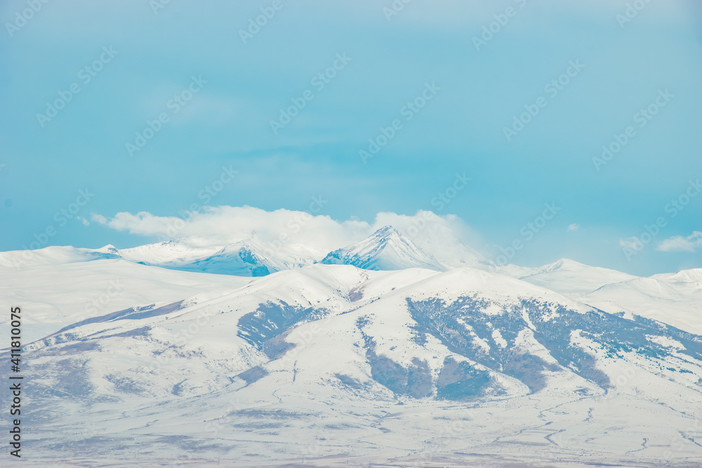 winter mountain landscape and blue sky