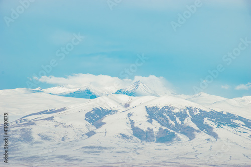 winter mountain landscape and blue sky
