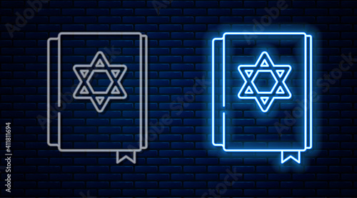 Glowing neon line Jewish torah book icon isolated on brick wall background. Pentateuch of Moses. On the cover of the Bible is the image of the Star of David. Vector.