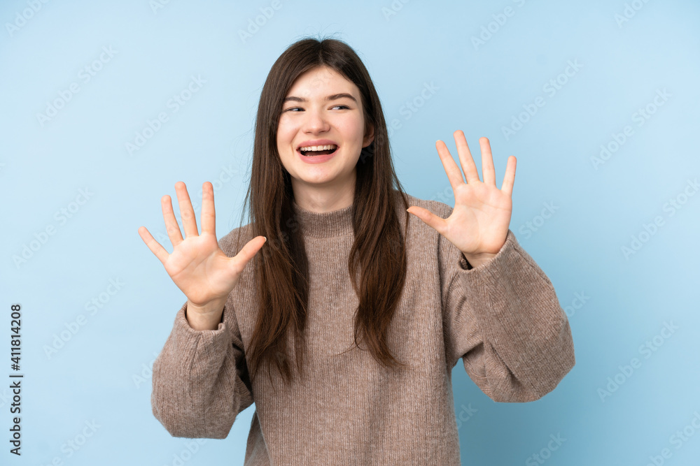 Young Ukrainian teenager girl wearing a sweater over isolated blue background counting ten with fingers Young Ukrainian teenager girl wearing a sweater over isolated blue background counting ten with fingers