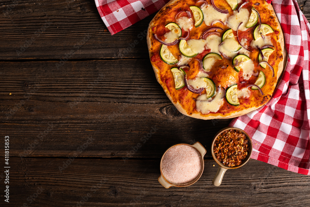Tasty pizza with cooking ingredients on background. Tasty pizza with cooking ingredients on background.