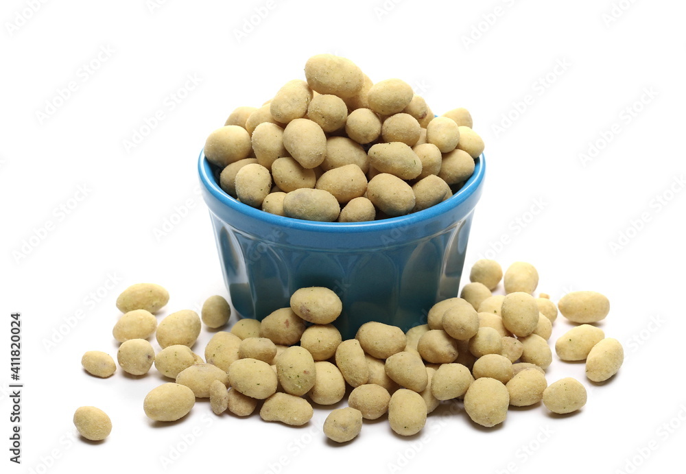 Sour cream and onion flavored peanuts pile in blue porcelain bowl isolated on white background Sour cream and onion flavored peanuts pile in blue porcelain bowl isolated on white background