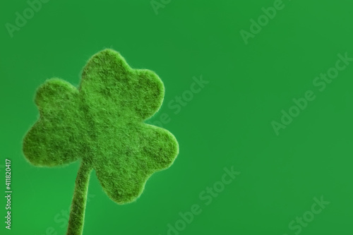 Decorative clover leaf on green background, space for text. Saint Patrick's Day celebration