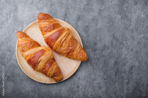 Fresh Baked Croissants on stone table. Top View.