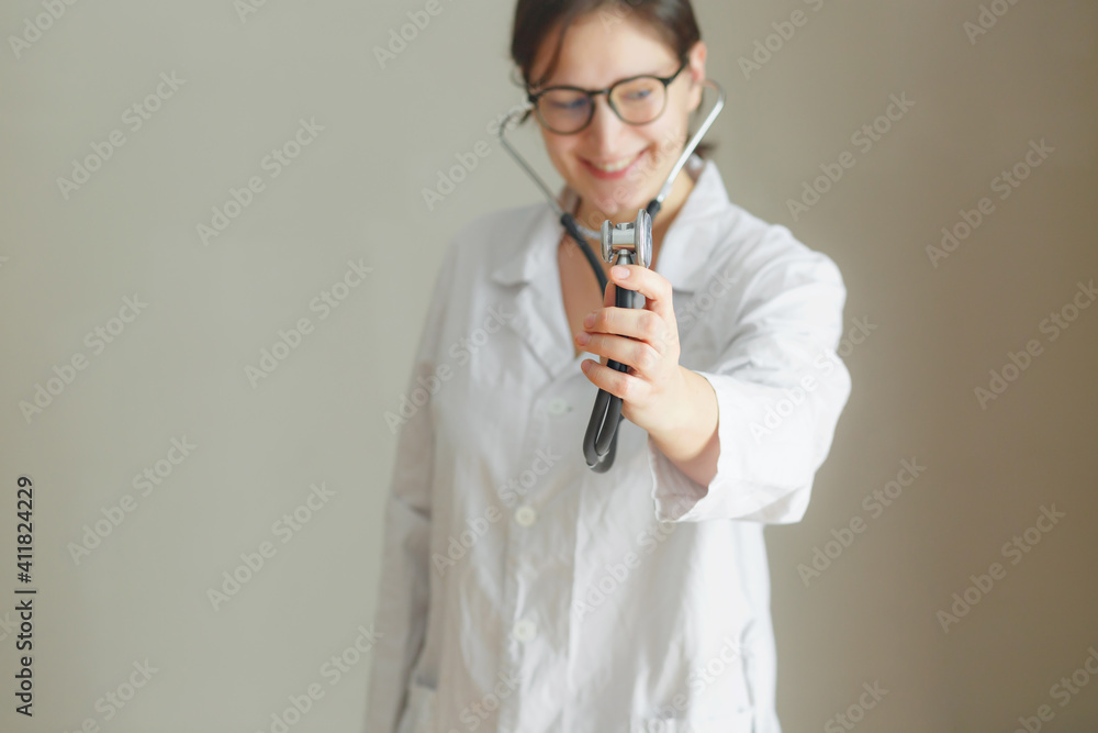 Young beautiful woman doctor is waiting for new visit, smiling and positive doctor Young beautiful woman doctor is waiting for new visit, smiling and positive doctor