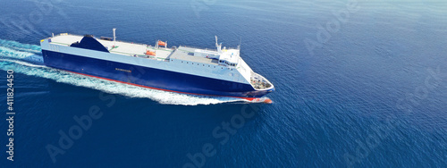 Aerial drone ultra wide photo of large RoRo (Roll on-off) vessel cruising the Atlantic Ocean deep blue sea photo