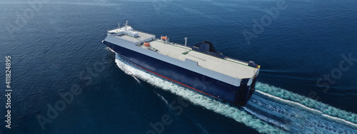Obraz na plátně Aerial drone ultra wide photo of large RoRo (Roll on-off) vessel cruising the At