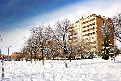 Snow scene on a sunny day. Calle Real de Arganda, in Vallecas after the Filomena snow storm photo