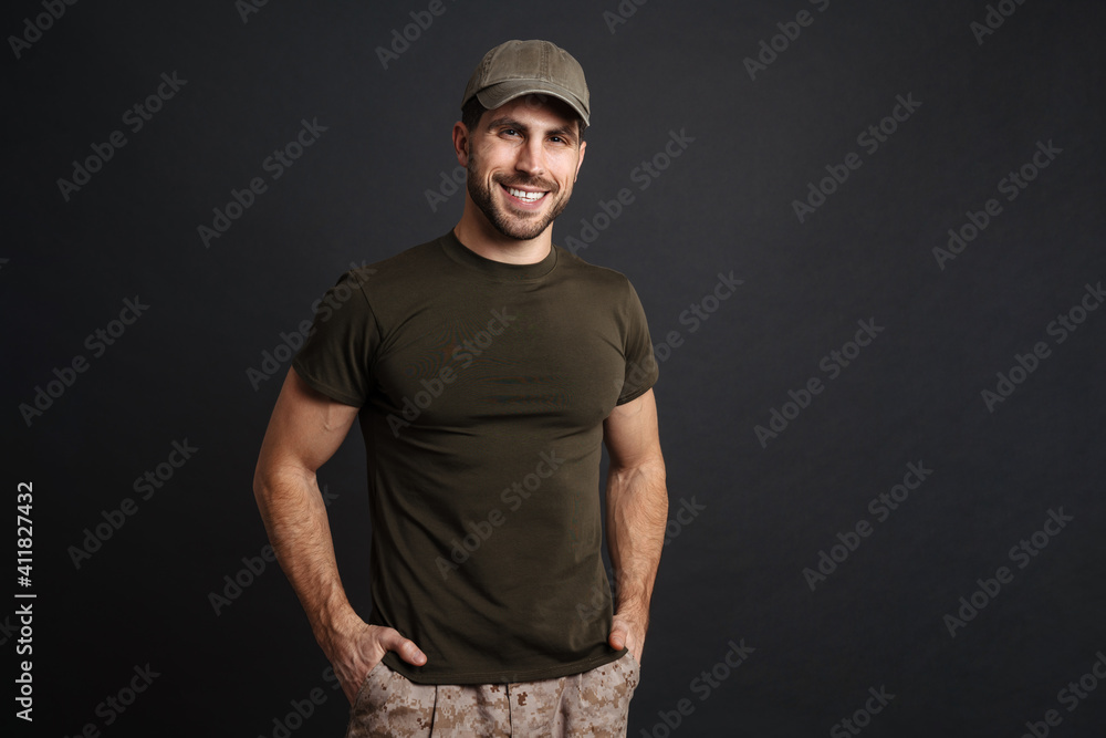 Happy masculine soldier man military and looking at camera