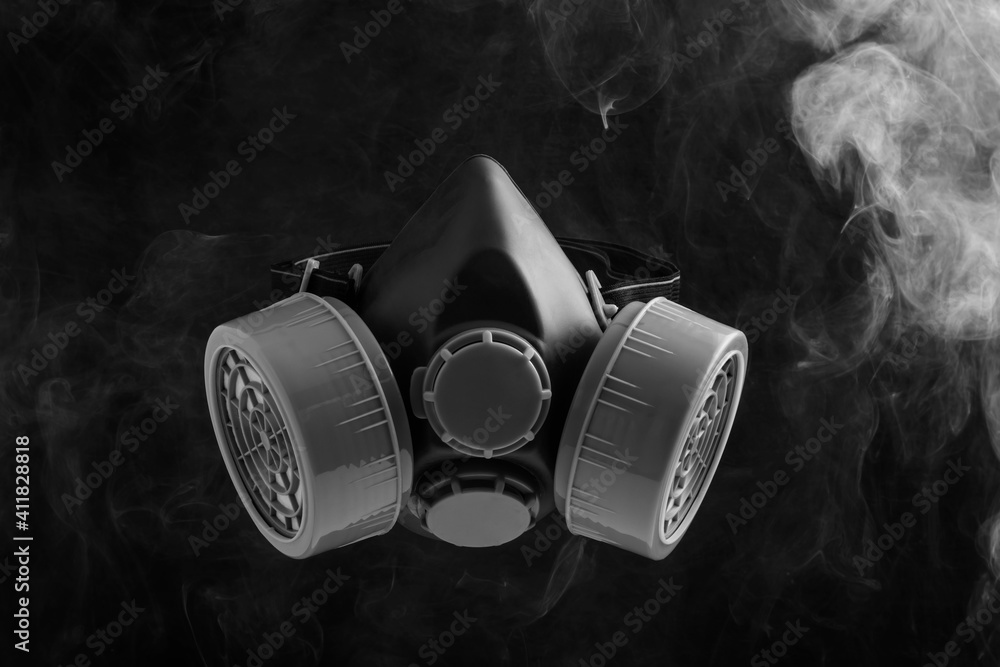 Black gas mask on black background with smoke or toxic gas Stock Photo |  Adobe Stock