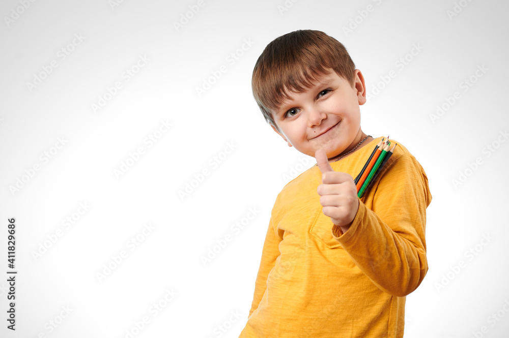 child shows class by hand on white background. colored pencils in your pocket child shows class by hand on white background. colored pencils in your pocket