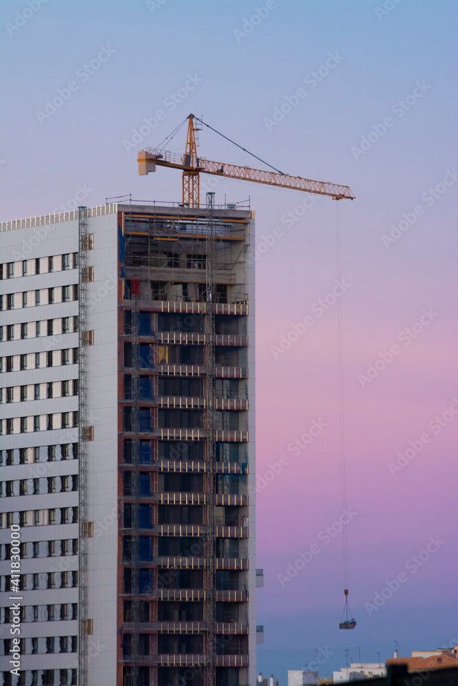 A building under construction and a crane