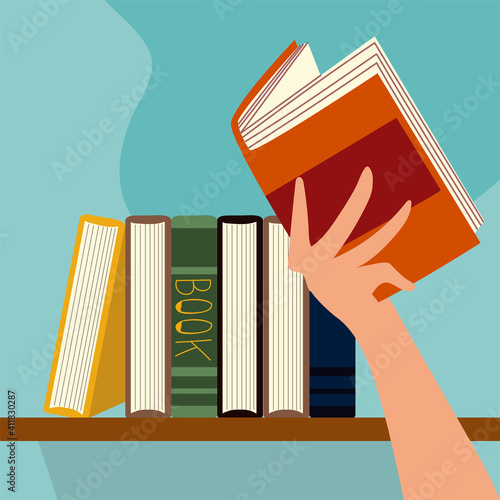 hand with open book and textbooks on wood shelf
