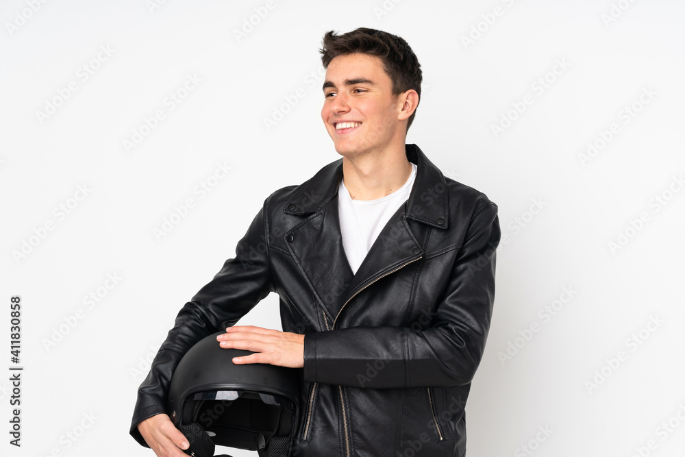 Man holding a motorcycle helmet isolated on white background laughing Man holding a motorcycle helmet isolated on white background laughing