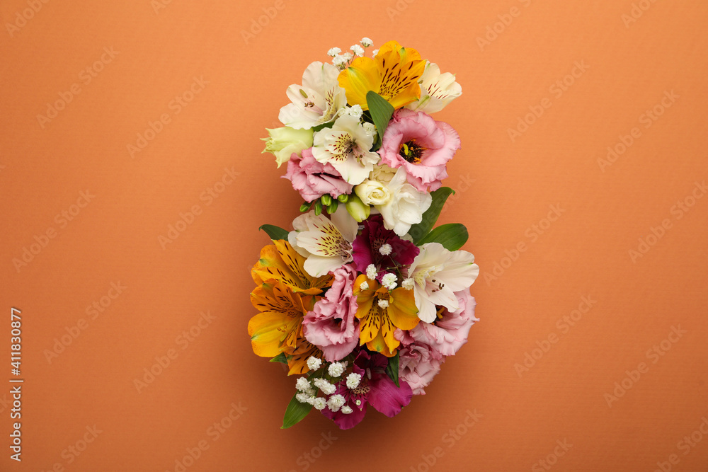 Number 8 made of beautiful flowers on orange background, flat lay. International Women's day