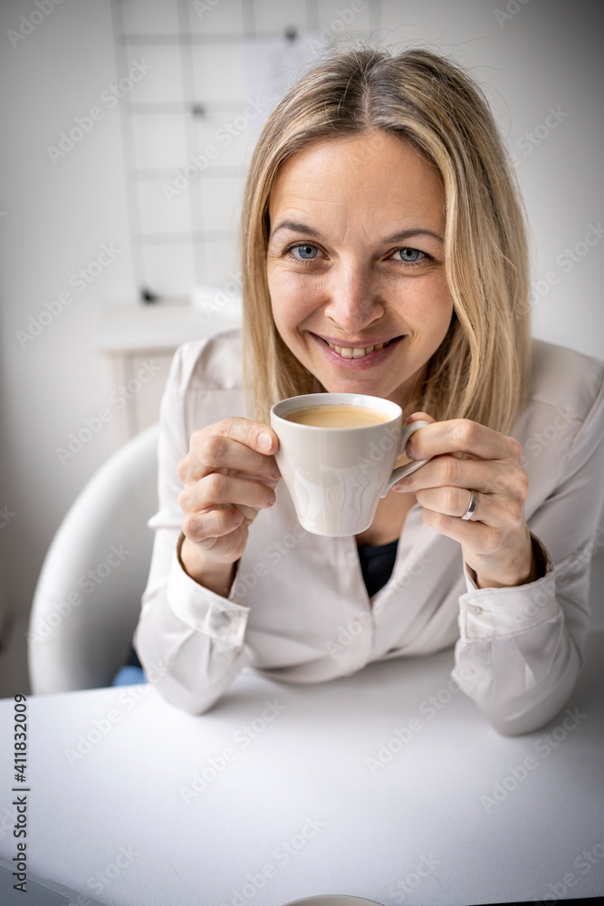 Business woman enjoy coffee break while working in 5office Business woman enjoy coffee break while working in 5office