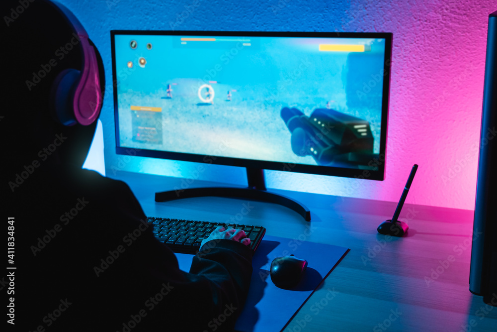 Girl playing shooter online video game - Technology trend concept - Focus on right hand Girl playing shooter online video game - Technology trend concept - Focus on right hand