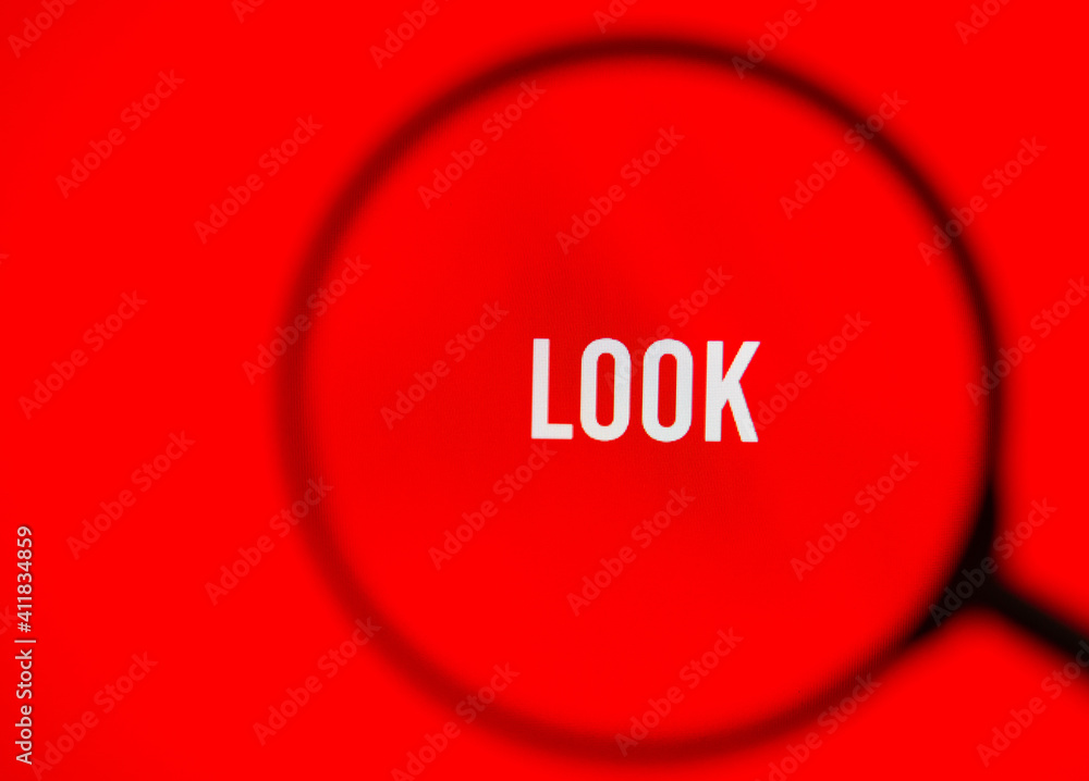 Word look on red screen through magnifying glass. Word look on red screen through magnifying glass.