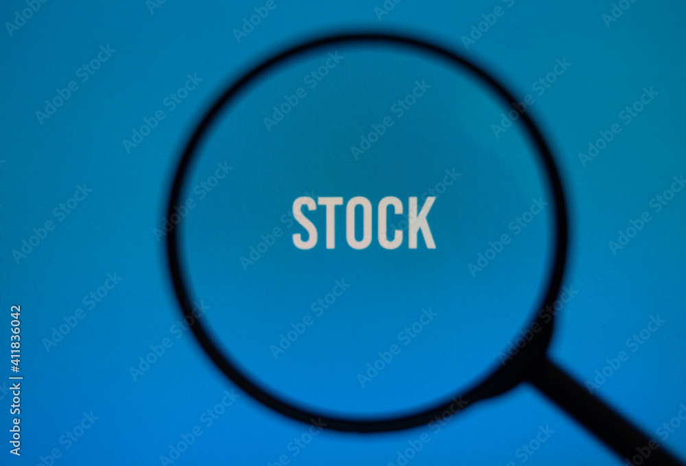 Word stock on blue screen through magnifying glass. Word stock on blue screen through magnifying glass.